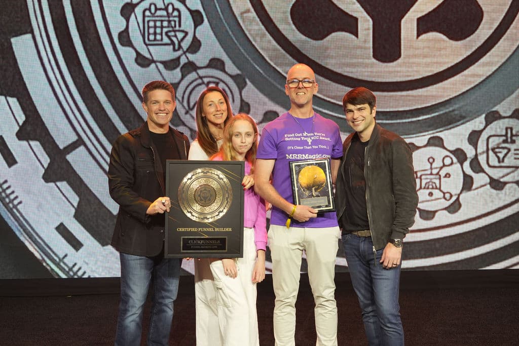James Curran receiving Certified Funnel Builder award on stage